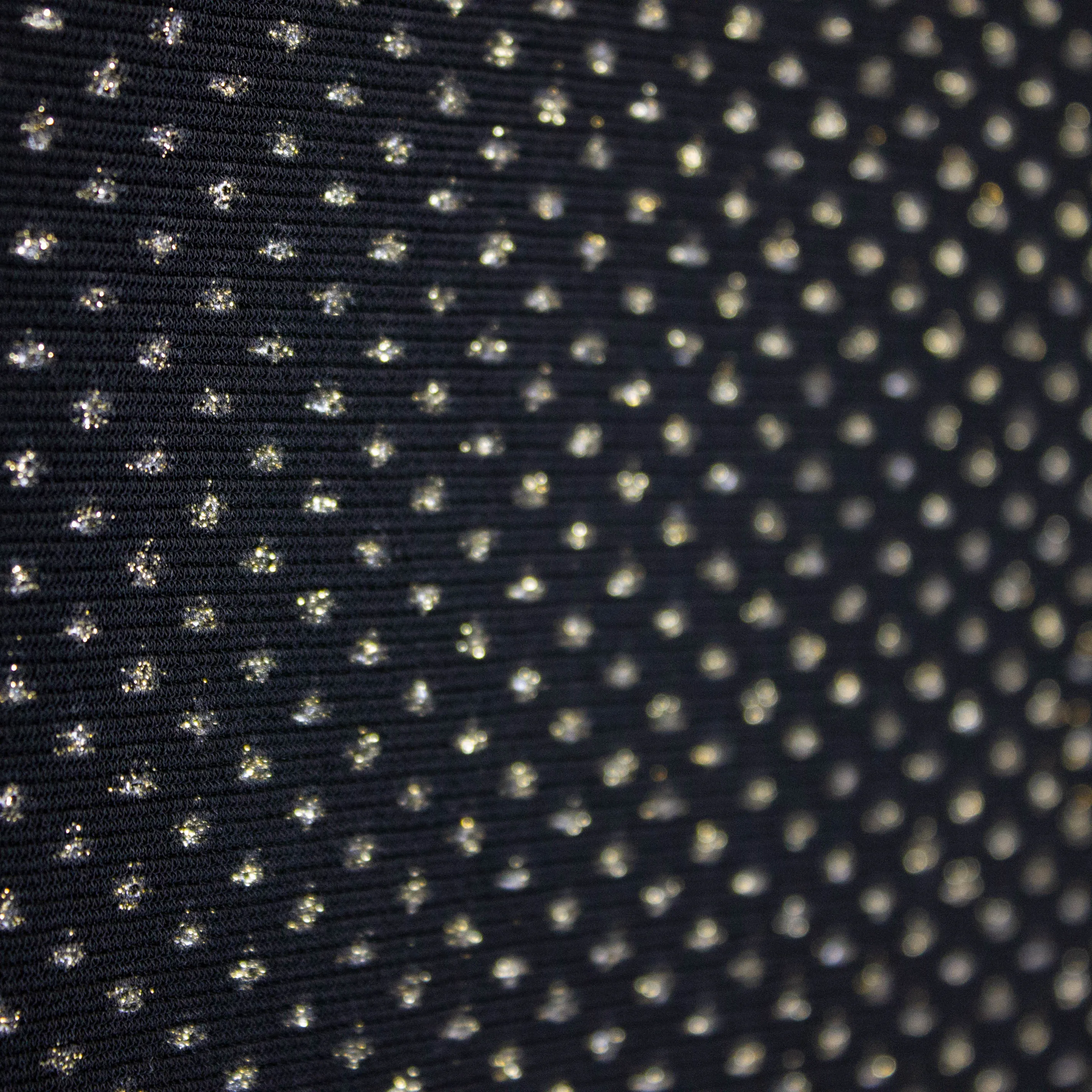 Polyester elastisch zwart met grote gouden glitters